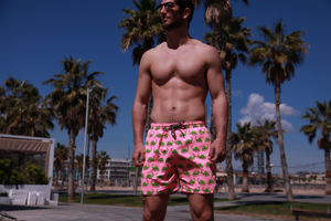 Pantaloneta de baño rosada para hombre con diseño de dinosaurios